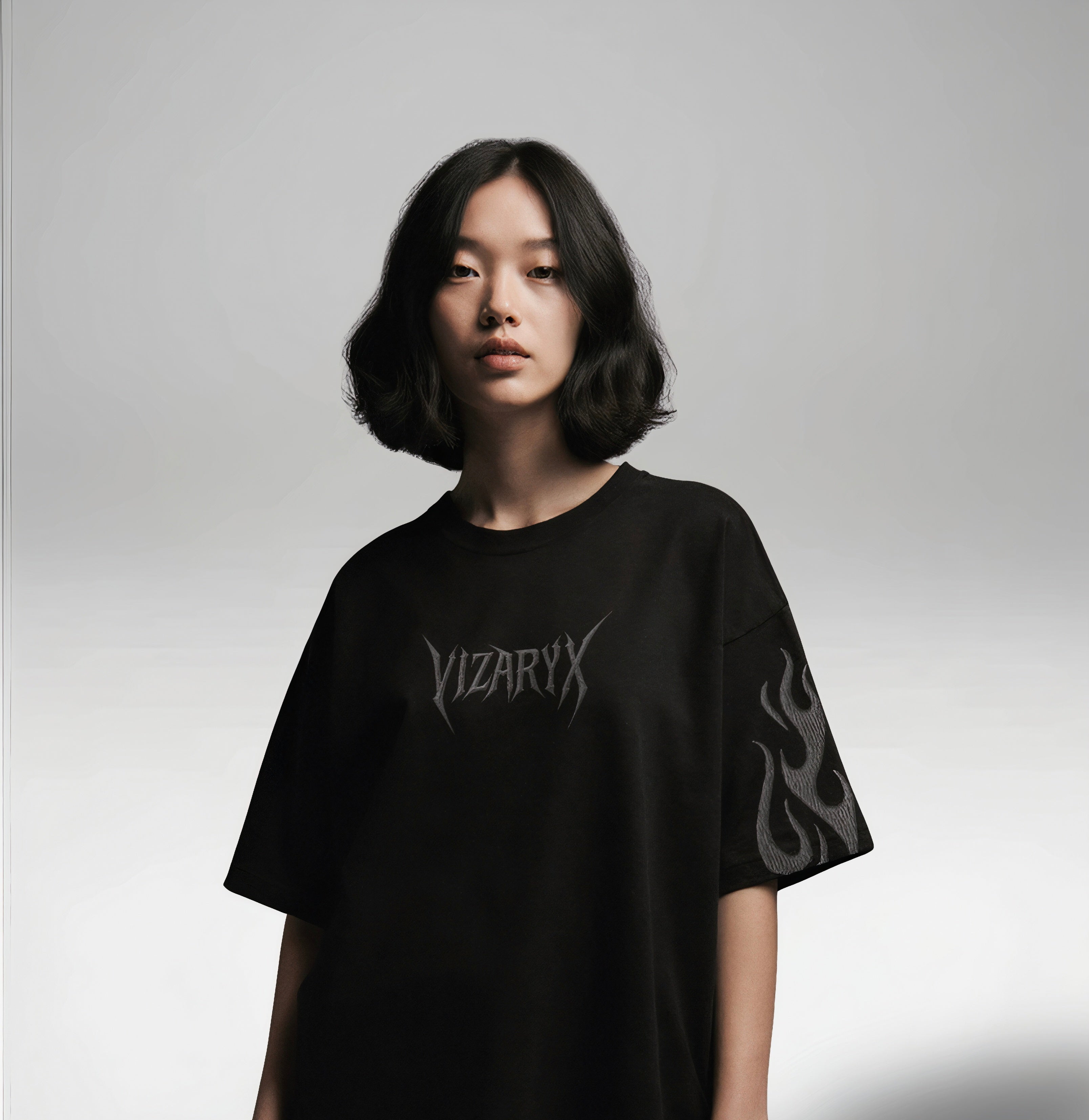 Person wearing a black t-shirt with 'VIZARY' logo on a gray background