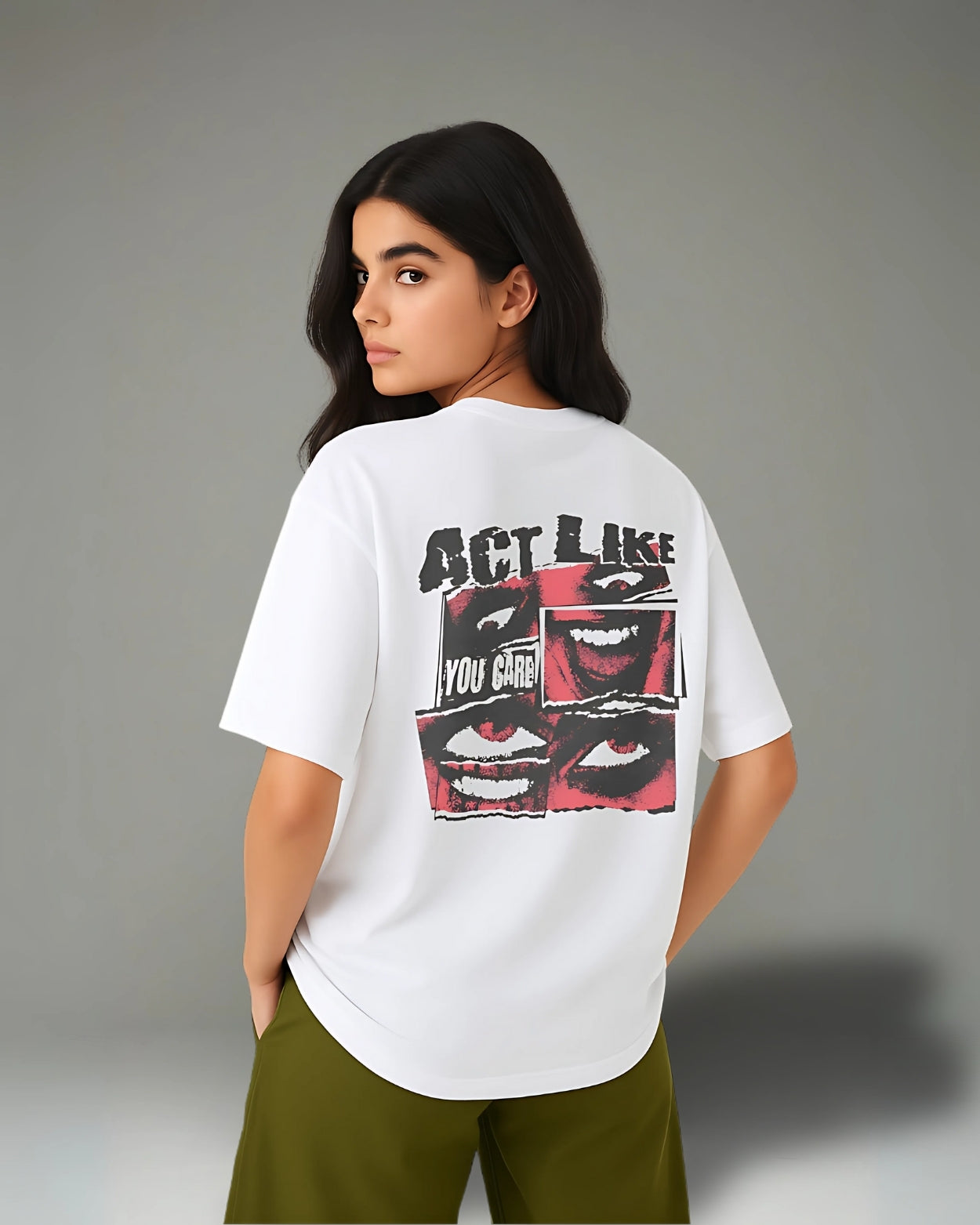 Person wearing a white t-shirt with graphic design and text on the back against a gray background